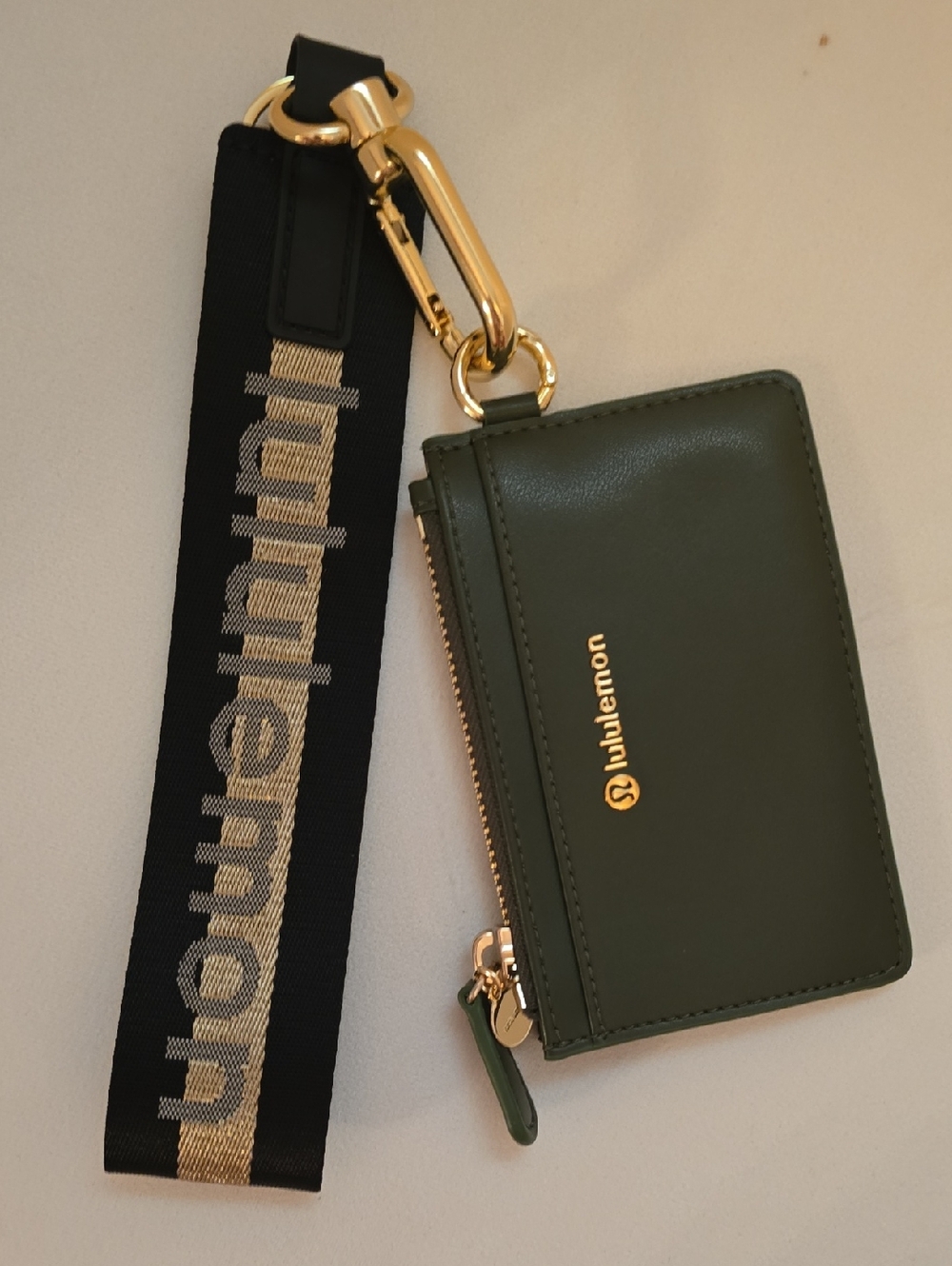 lululemon athletica Olive Green Leather Wristlet with Black Gold Logo Strap